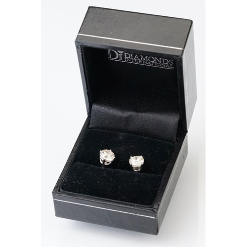 41 - Pair of diamond solitaire 14ct white gold stud earrings, modern round brilliant cut diamond, each we... 