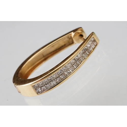 44 - Pair of diamond 14ct yellow gold elongated hoop earrings, two rows of a total of thirty-two square m... 