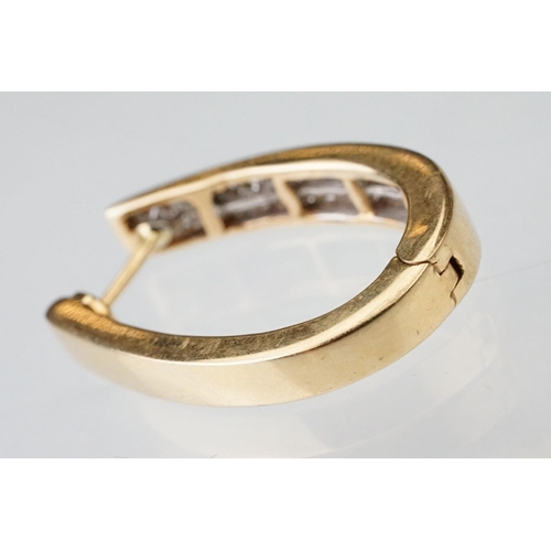 44 - Pair of diamond 14ct yellow gold elongated hoop earrings, two rows of a total of thirty-two square m... 
