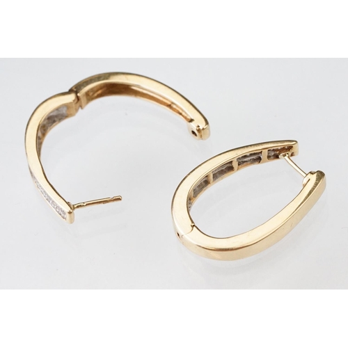 44 - Pair of diamond 14ct yellow gold elongated hoop earrings, two rows of a total of thirty-two square m... 