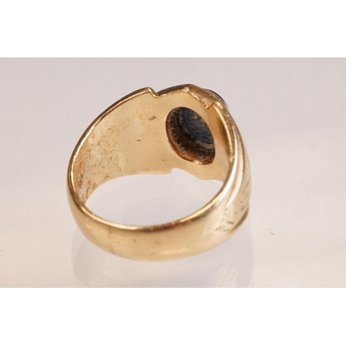 40 - Star sapphire 18ct yellow gold ring, the oval cabochon cut sapphire displaying six-rayed star, dimen... 