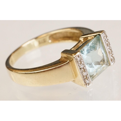 61 - Topaz and diamond 9ct yellow gold ring, the square mixed cut topaz measuring approx 7.5mm x 8mm, par... 