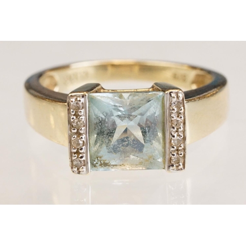 61 - Topaz and diamond 9ct yellow gold ring, the square mixed cut topaz measuring approx 7.5mm x 8mm, par... 