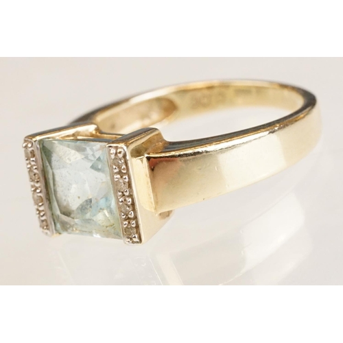 61 - Topaz and diamond 9ct yellow gold ring, the square mixed cut topaz measuring approx 7.5mm x 8mm, par... 