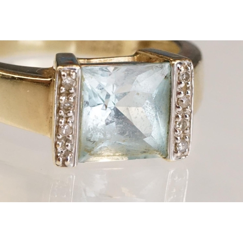 61 - Topaz and diamond 9ct yellow gold ring, the square mixed cut topaz measuring approx 7.5mm x 8mm, par... 