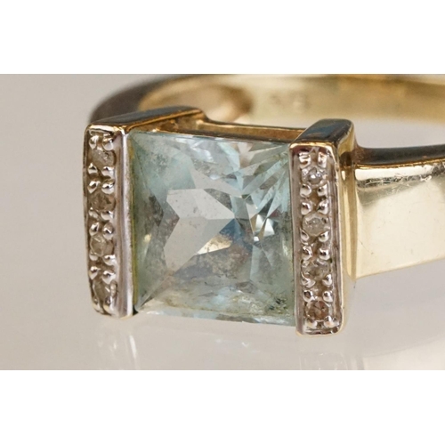 61 - Topaz and diamond 9ct yellow gold ring, the square mixed cut topaz measuring approx 7.5mm x 8mm, par... 