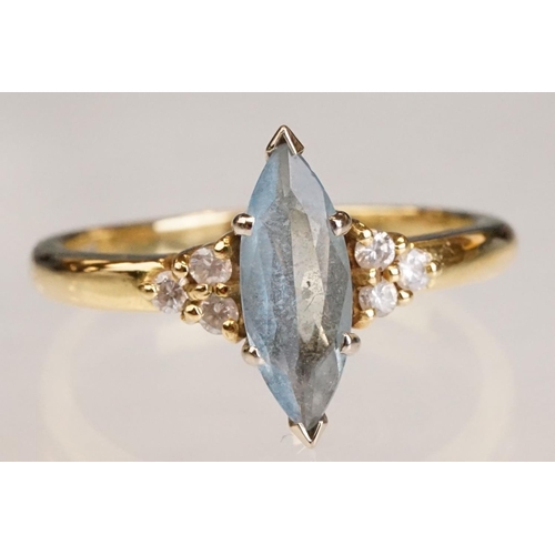 62 - Aquamarine and diamond 18ct yellow gold ring, the marquise cut aquamarine measuring approx 12.5mm x ... 