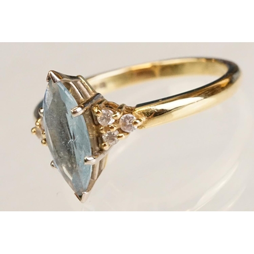 62 - Aquamarine and diamond 18ct yellow gold ring, the marquise cut aquamarine measuring approx 12.5mm x ... 