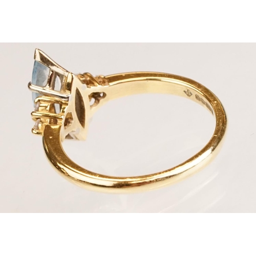 62 - Aquamarine and diamond 18ct yellow gold ring, the marquise cut aquamarine measuring approx 12.5mm x ... 