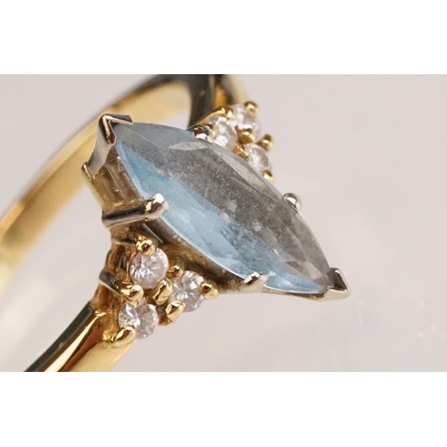 62 - Aquamarine and diamond 18ct yellow gold ring, the marquise cut aquamarine measuring approx 12.5mm x ... 
