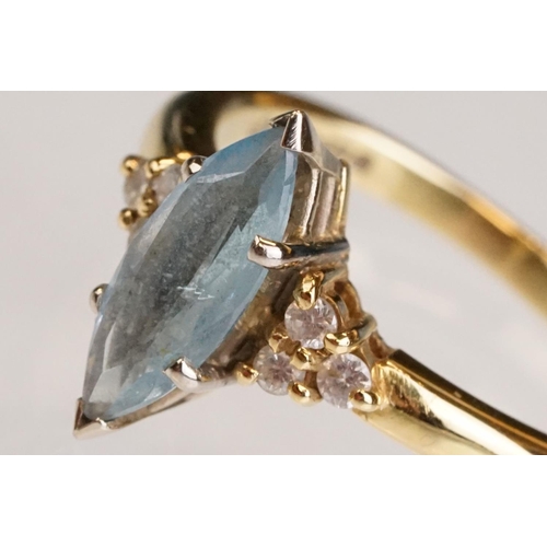 62 - Aquamarine and diamond 18ct yellow gold ring, the marquise cut aquamarine measuring approx 12.5mm x ... 