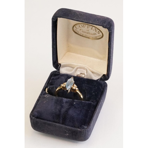 62 - Aquamarine and diamond 18ct yellow gold ring, the marquise cut aquamarine measuring approx 12.5mm x ... 
