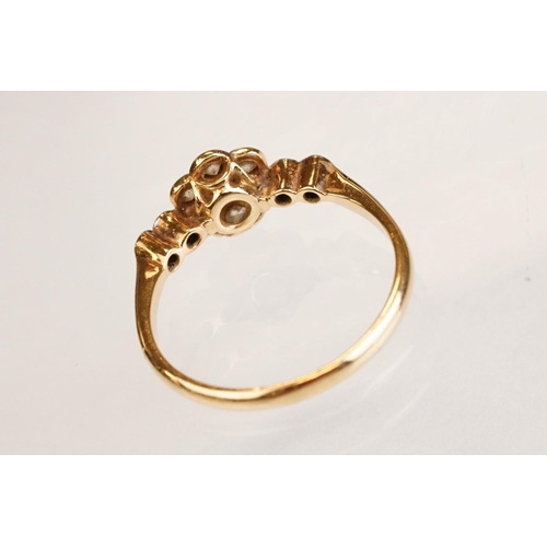 63 - Early 20th century diamond 18ct yellow gold and platinum set flower head ring, eleven small round ei... 