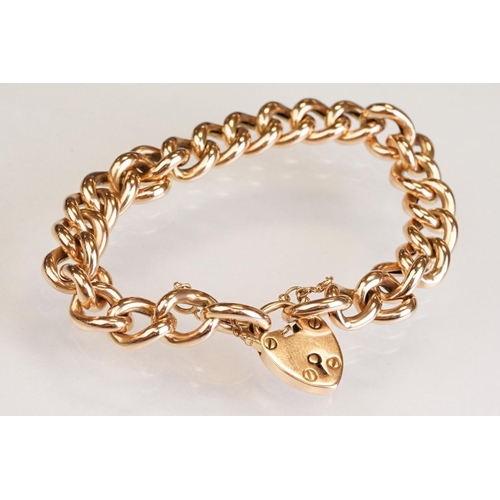 64 - 15ct yellow gold curb link bracelet with padlock clasp, one link and padlock clasp hallmarked