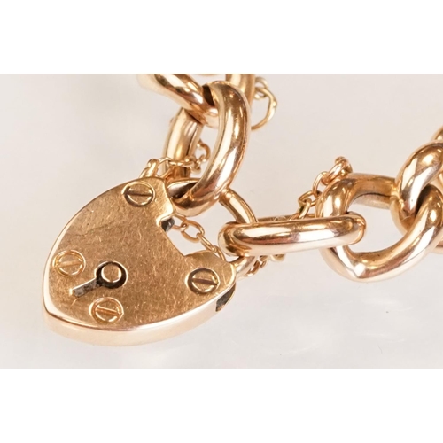 64 - 15ct yellow gold curb link bracelet with padlock clasp, one link and padlock clasp hallmarked