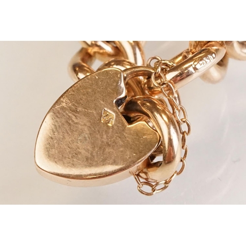 64 - 15ct yellow gold curb link bracelet with padlock clasp, one link and padlock clasp hallmarked