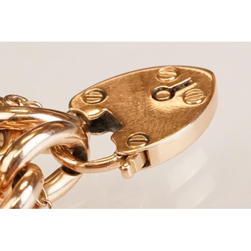 64 - 15ct yellow gold curb link bracelet with padlock clasp, one link and padlock clasp hallmarked