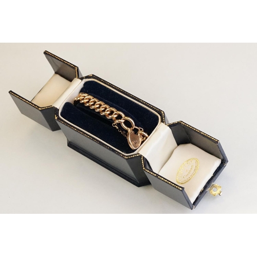 64 - 15ct yellow gold curb link bracelet with padlock clasp, one link and padlock clasp hallmarked