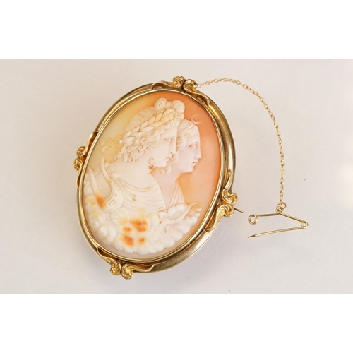 66 - 19th century shell cameo brooch depicting two female figures, yellow metal surround, hinged pin and ... 