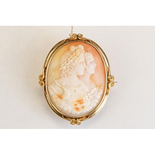 66 - 19th century shell cameo brooch depicting two female figures, yellow metal surround, hinged pin and ... 