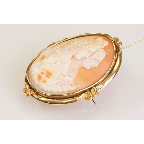 66 - 19th century shell cameo brooch depicting two female figures, yellow metal surround, hinged pin and ... 