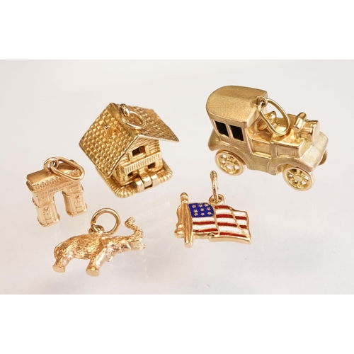 70 - Three 9ct yellow gold charms, an 8ct gold charm, a 14ct enamelled charm and a yellow metal charm (6)