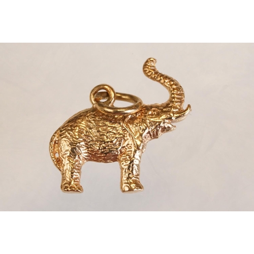 70 - Three 9ct yellow gold charms, an 8ct gold charm, a 14ct enamelled charm and a yellow metal charm (6)
