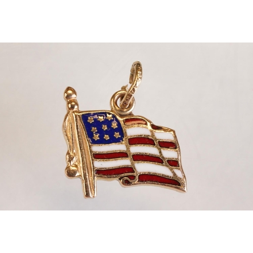 70 - Three 9ct yellow gold charms, an 8ct gold charm, a 14ct enamelled charm and a yellow metal charm (6)