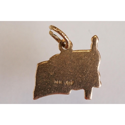 70 - Three 9ct yellow gold charms, an 8ct gold charm, a 14ct enamelled charm and a yellow metal charm (6)
