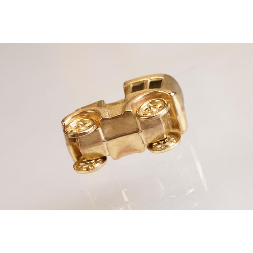 70 - Three 9ct yellow gold charms, an 8ct gold charm, a 14ct enamelled charm and a yellow metal charm (6)