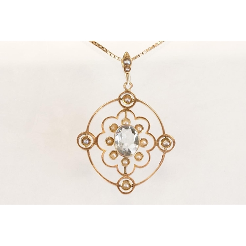71 - Early 20th century aquamarine and seed pearl 9ct yellow gold pendant, the openwork design with oval ... 