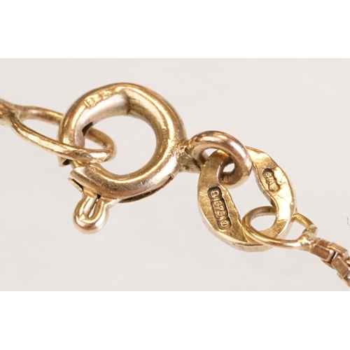 71 - Early 20th century aquamarine and seed pearl 9ct yellow gold pendant, the openwork design with oval ... 