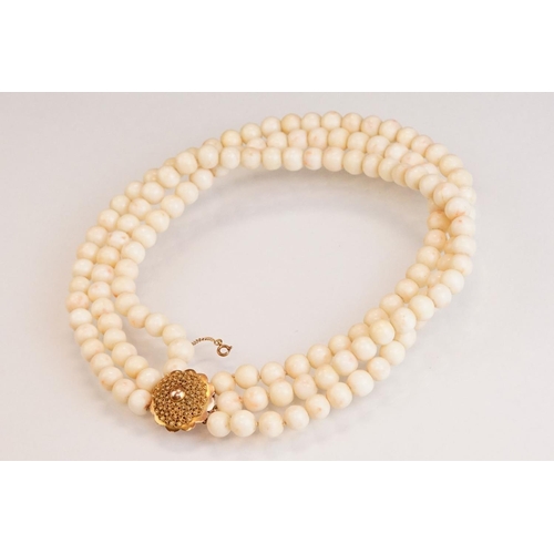 80 - Coral 14ct yellow gold three strand necklace, round coral beads, diameter approx 9mm, the cannetille... 