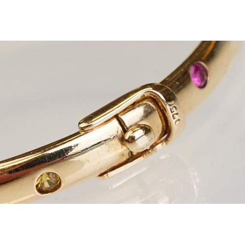 82 - Gem set 18ct yellow gold hinged bangle, pink, blue and yellow small round brilliant cut sapphires an... 