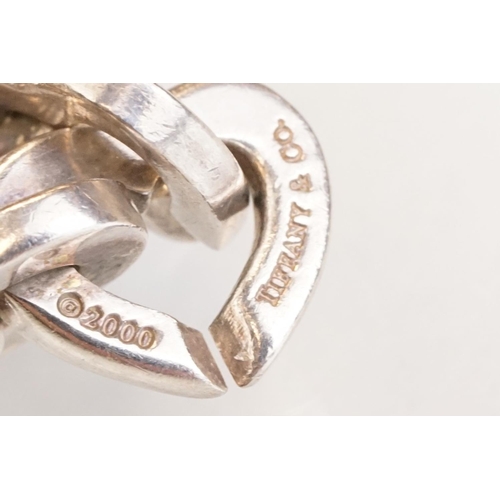 83 - Tiffany & Co parcel gilt silver heart shaped link bracelet, the centre heart gold plated, the clasp ... 