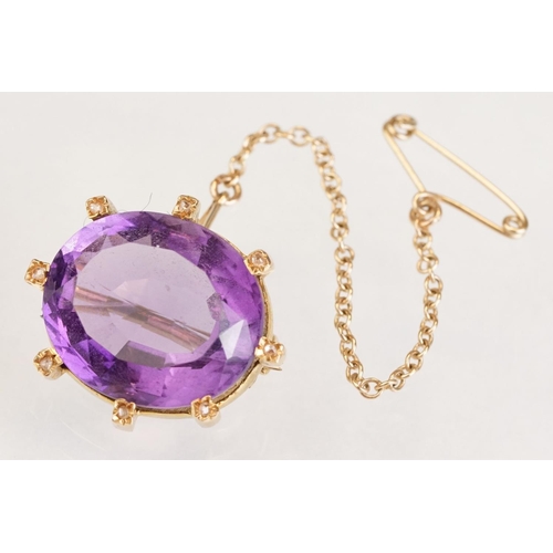 84 - Amethyst and diamond yellow metal lace pin brooch, the oval mixed cut amethyst measuring approx 18mm... 