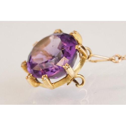 84 - Amethyst and diamond yellow metal lace pin brooch, the oval mixed cut amethyst measuring approx 18mm... 