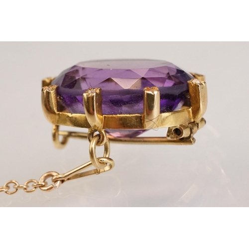 84 - Amethyst and diamond yellow metal lace pin brooch, the oval mixed cut amethyst measuring approx 18mm... 