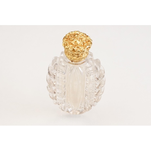 85 - Victorian scent bottle with yellow metal hinged lid, cut glass body of flattened oval form and stopp... 