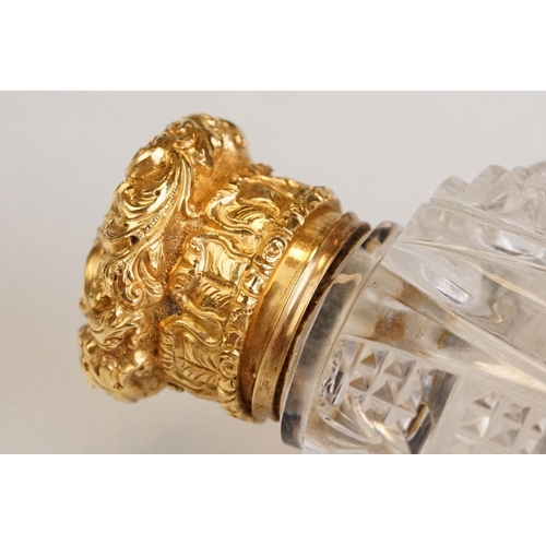 85 - Victorian scent bottle with yellow metal hinged lid, cut glass body of flattened oval form and stopp... 