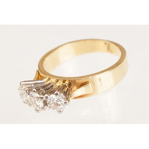 86 - Diamond three stone 18ct yellow and white gold set ring, three round brilliant cut diamonds, total d... 