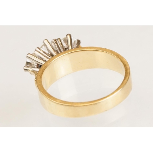 86 - Diamond three stone 18ct yellow and white gold set ring, three round brilliant cut diamonds, total d... 