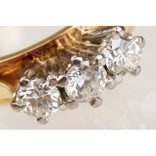86 - Diamond three stone 18ct yellow and white gold set ring, three round brilliant cut diamonds, total d... 