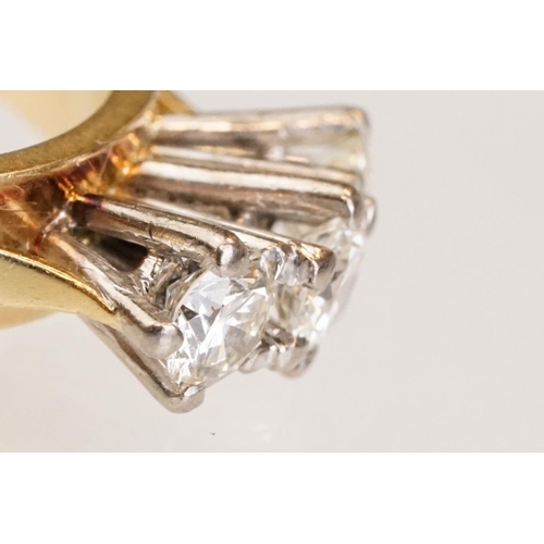 86 - Diamond three stone 18ct yellow and white gold set ring, three round brilliant cut diamonds, total d... 
