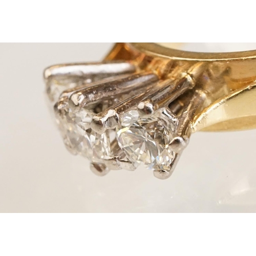86 - Diamond three stone 18ct yellow and white gold set ring, three round brilliant cut diamonds, total d... 