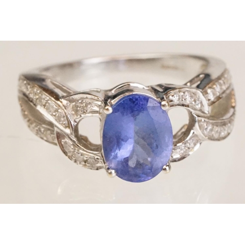 88 - Tanzanite and diamond 18ct white gold ring, the oval mixed cut tanzanite measuring approx 9mm x 7mm,... 