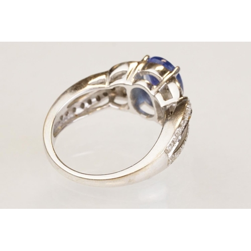 88 - Tanzanite and diamond 18ct white gold ring, the oval mixed cut tanzanite measuring approx 9mm x 7mm,... 