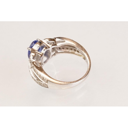 88 - Tanzanite and diamond 18ct white gold ring, the oval mixed cut tanzanite measuring approx 9mm x 7mm,... 