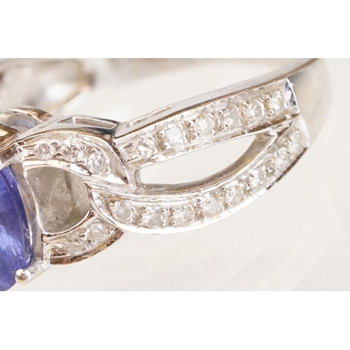 88 - Tanzanite and diamond 18ct white gold ring, the oval mixed cut tanzanite measuring approx 9mm x 7mm,... 