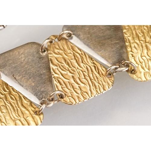 89 - 14ct yellow and white gold panel bracelet, alternating plain polished triangular white gold panels w... 